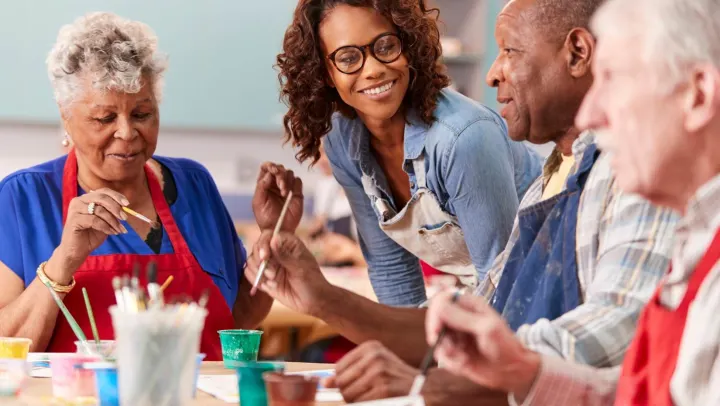group of elderly people painting